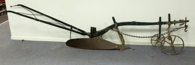 A single furrow two-wheeled hand plough