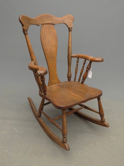 Victorian oak armed rocking chair.