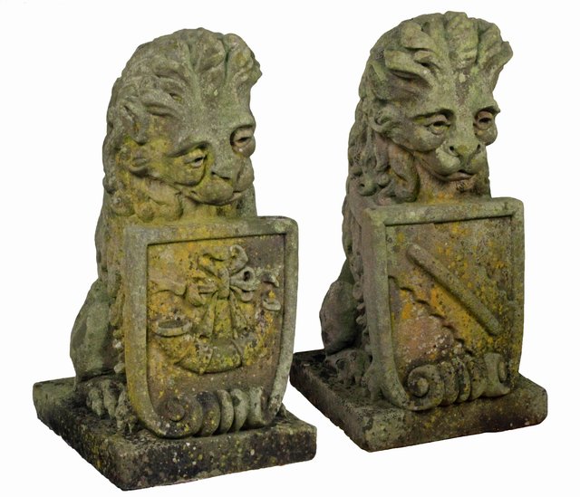 A pair of stone armorial lions