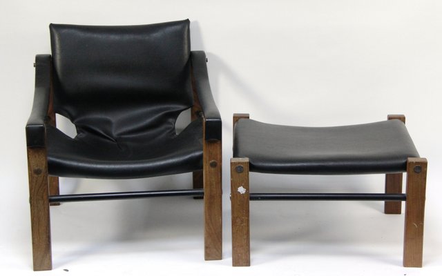 An Arkana armchair with padded seat