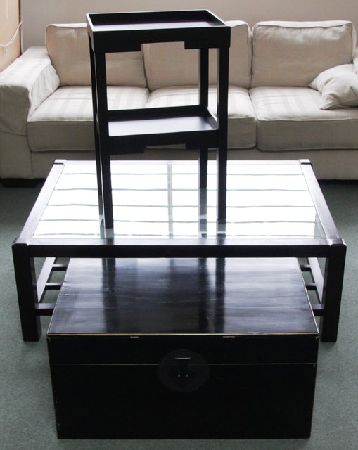 A Chinese coffee table with glass top
