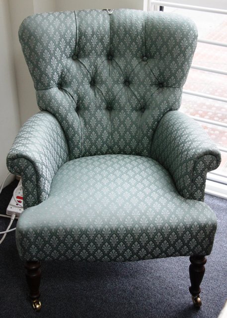 A Victorian style button upholstered