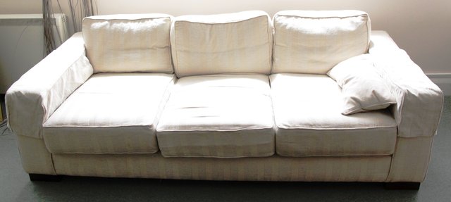 A pair of three-seater sofas 219cm