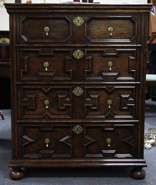 An oak moulded front cabinet 17th