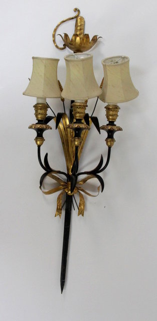 An ebonised metal and gilt wood three