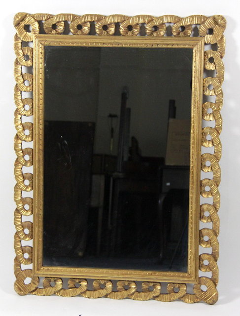 A rectangular gilt plaster wall mirror