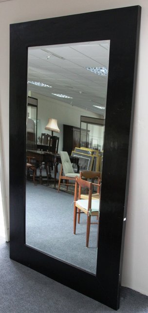 A large mirror with rectangular bevelled