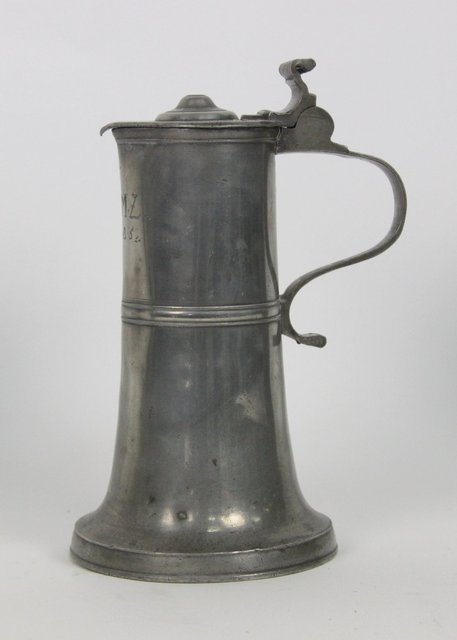 A Swiss pewter lidded flagon initialled 165b54