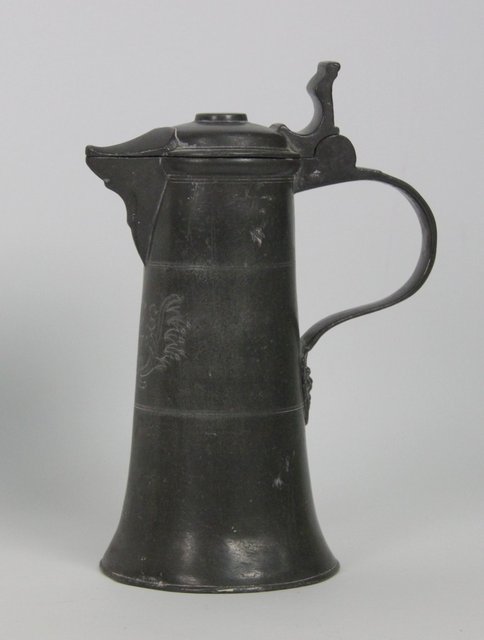 A Swiss pewter lidded flagon initialled 165b55