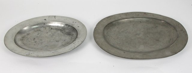 Two pewter oval platters each with