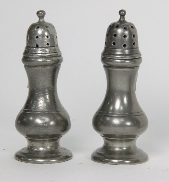 A pair of pewter baluster pepper