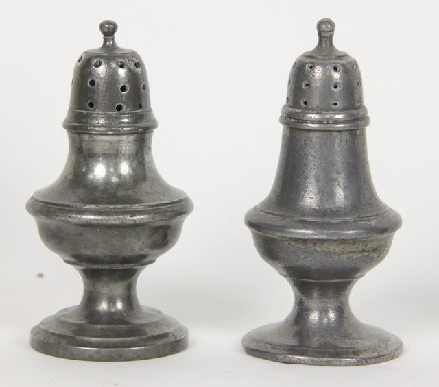 A near pair of pewter pepper pots circa