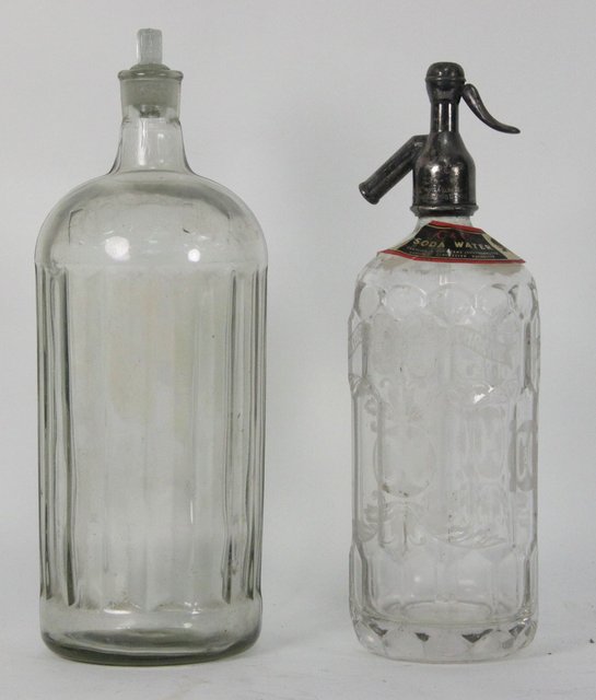 A fluted glass bottle labelled 165bc4