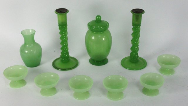 A pair of green glass candlesticks
