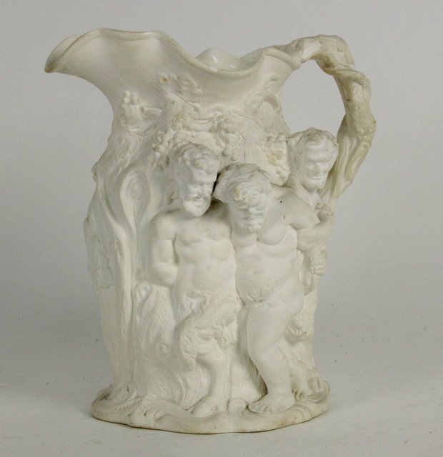 An unglazed relief moulded jug with