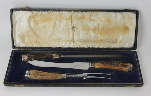 A three-piece plated carving set