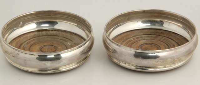 A pair of silver wine coasters 165be9