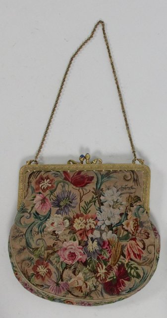 A tapestry evening bag with design to