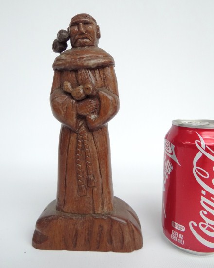 Folk art wooden Saint Francis with bird