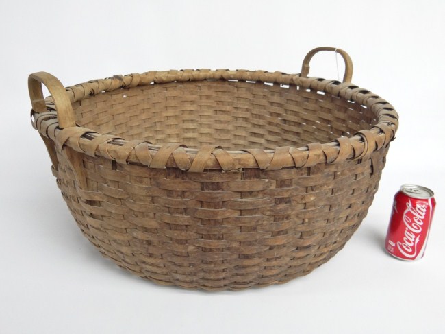 19th c. round basket with handles. 23