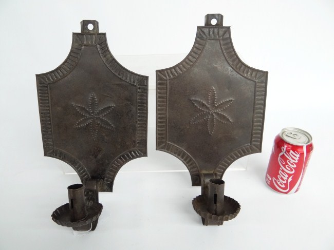 Pair punch decorated tin wall sconces.