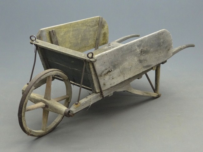 Early primitive wheelbarrow.