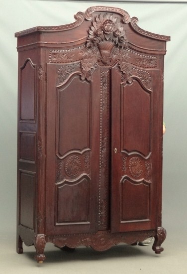 Contemporary carved two door armoire.