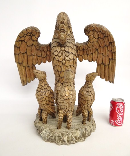 Folk art wooden eagle and eaglets carving.