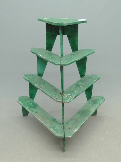 Early plant stand in green paint.