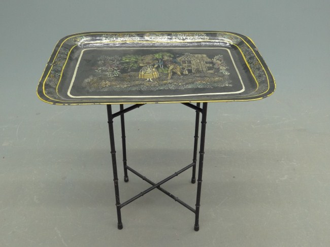 Early painted tole tray on stand.