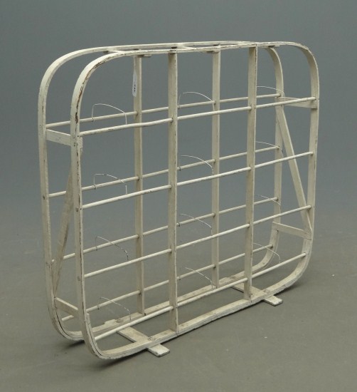 Wooden industrial rack in white paint.