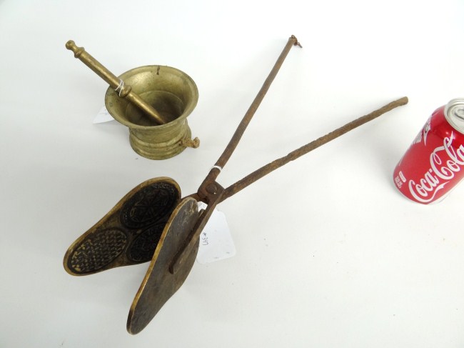 Brass mortar and pestle along with