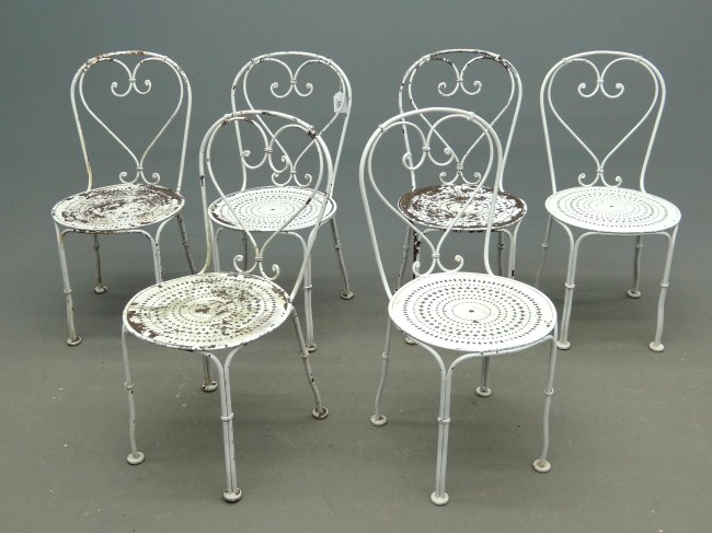 Set of six pierced seat garden chairs