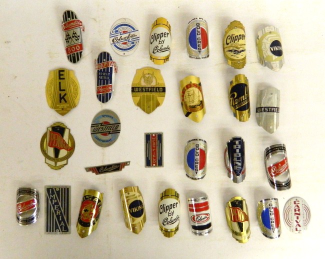 Head badge lot (28) including: