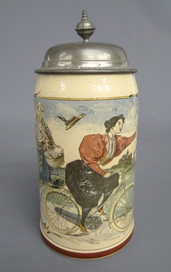 German stein painted with female cyclist.