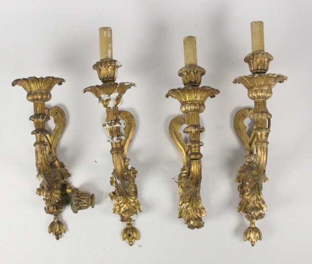 A set of four carved and gilded