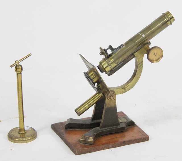 A brass microscope by J and C Robbins