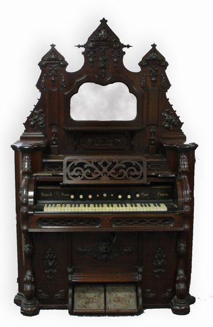 A harmonium with mirror back superstructure