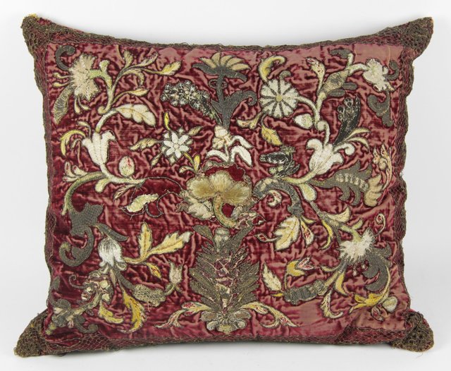 An embroidered cushion covered