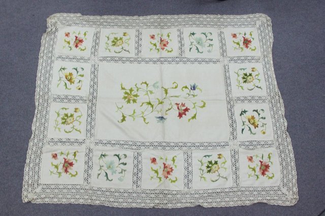 A Victorian crewel work table cloth