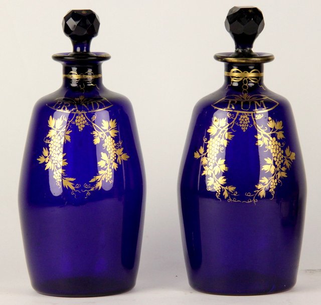 A pair of blue glass spirit decanters