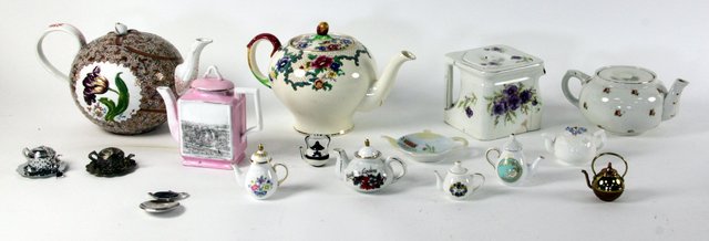 A quantity of ceramic novelty teapots