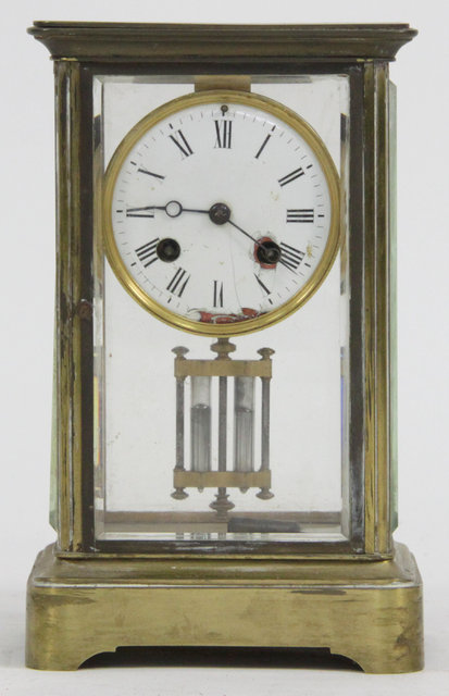 A four-glass mantel clock fitted an