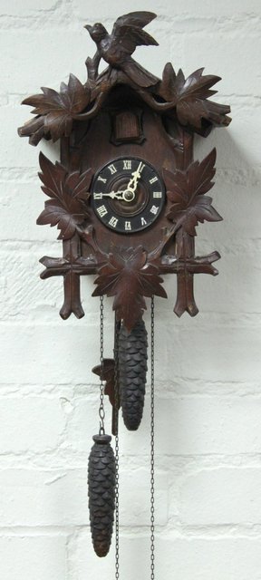 A Black Forest cuckoo clock in a carved