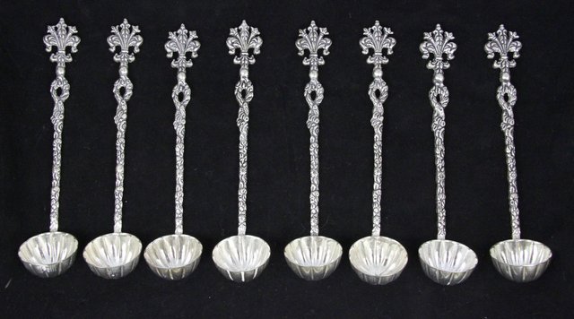 A set of eight plated strawberry spoons