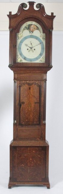 An oak and mahogany longcase clock