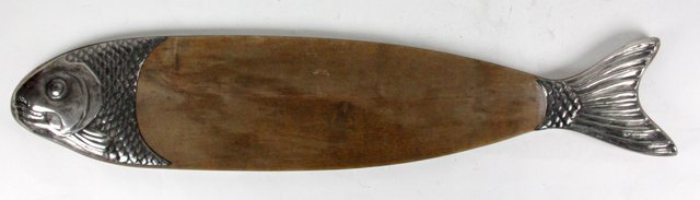 A wooden salmon serving dish with silver
