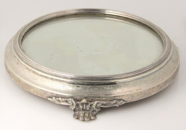 An electroplated cake stand with mirrored