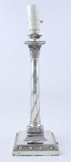 A Corinthian column silver candlestick