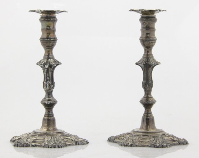 A pair of silver taper sticks J.G.C.